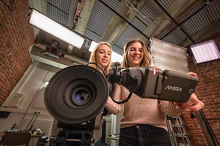 Image: Students working in the TV studio. 